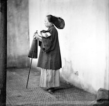 Canton, Kwangtung province, China: a lady holding a parasol, 1869. Creator: John Thomson.