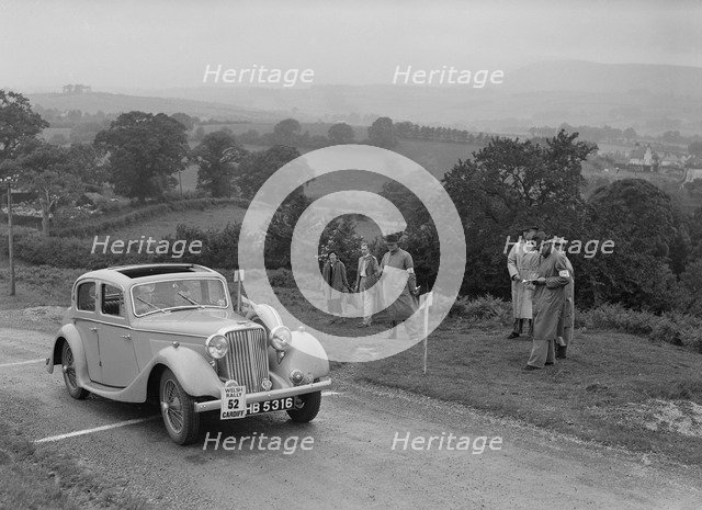 Jaguar SS saloon of N Howfield competing in the South Wales Auto Club Welsh Rally, 1937 Artist: Bill Brunell.