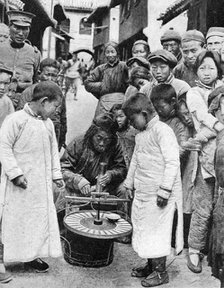Street gambling, China, 1922. Artist: BT Prideaux