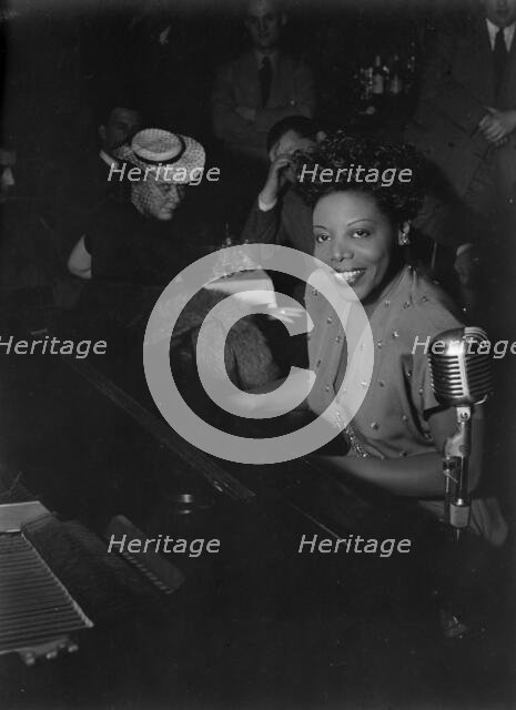 Portrait of Mary Lou Williams, Café Society (Downtown), New York, N.Y., ca. June 1947. Creator: William Paul Gottlieb.
