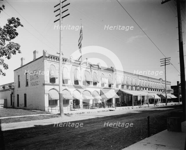 Commercial block with mineral bath house at left, probably Ypsilanti, Michigan, c1900-1910. Creator: Unknown.