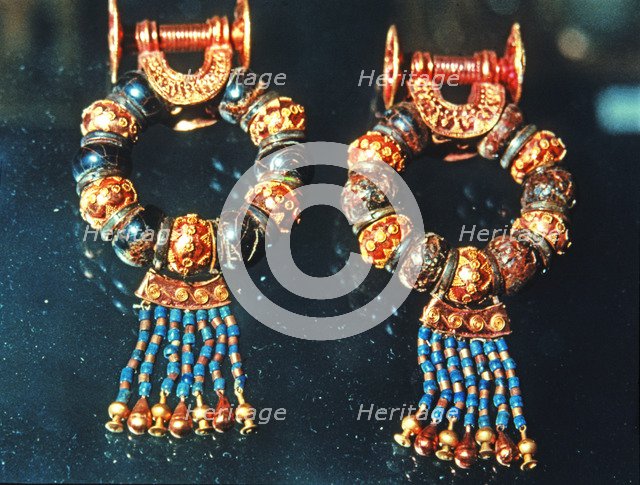 Gold earrings and jewels from the grave goods in Tutankhamun's tomb treasury.