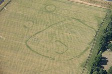 Enclosure and ring ditch crop marks near Minster, Kent, 2015. Creator: Historic England.