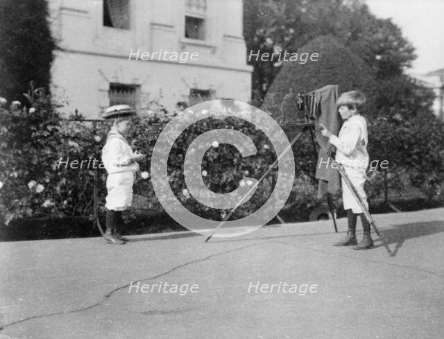 Archie Roosevelt photographing Quentin Roosevelt outdoors, 1902. Creator: Frances Benjamin Johnston.