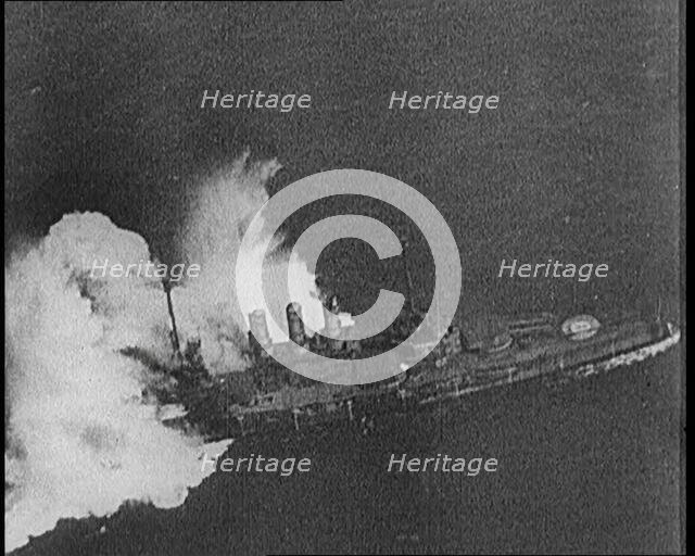 Large Warship Being Hit by an Exploding Shell, 1921. Creator: British Pathe Ltd.
