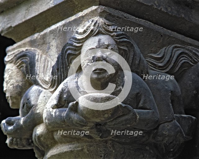 Capital of one of the Gothic galleries of the cloister built between 1387-1401. Female figure wit…
