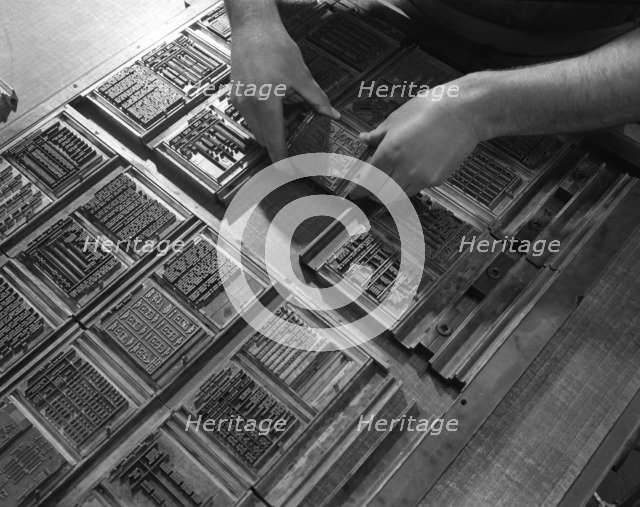 Linotype block being set in the dye at a printworks, Mexborough, South Yorkshire, 1959. Artist: Michael Walters