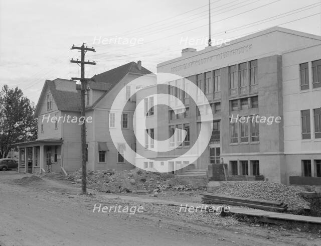 The new WPA courthouse alongside the old county courthouse, Bonners Ferry, Idaho, 1939. Creator: Dorothea Lange.