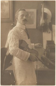 Portrait of a Violin Maker in Studio, 1895-1943. Creator: Louis Fleckenstein.