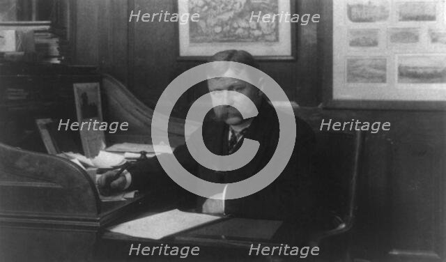 Man (banker?) seated at desk in American Security and Trust Co., Washington, D.C., c1890 - c1950. Creator: Frances Benjamin Johnston.