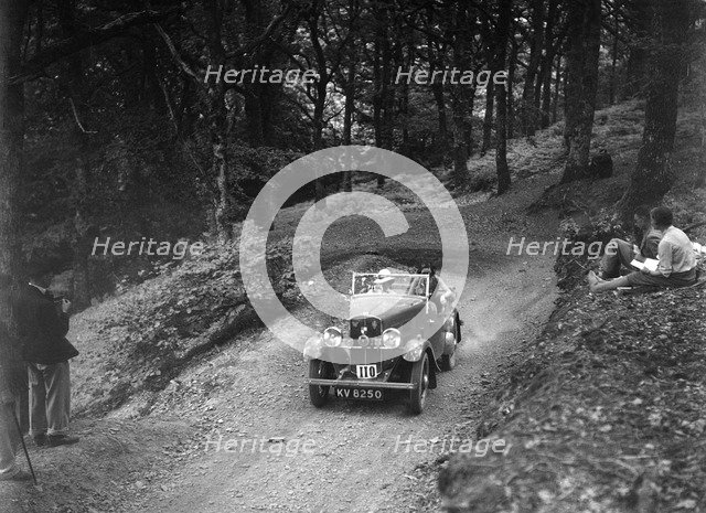 Triumph open tourer taking part in the B&HMC Brighton-Beer Trial, Fingle Bridge Hill, Devon, 1934. Artist: Bill Brunell.