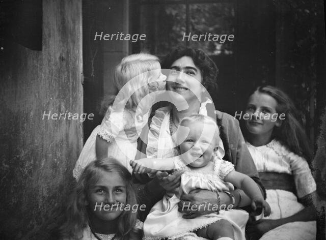 Unidentified woman with four children, portrait photograph, between 1911 and 1942. Creator: Arnold Genthe.