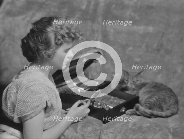 Cadmus, Miss, with Buzzer the cat, portrait photograph, 1914 Apr. 24. Creator: Arnold Genthe.
