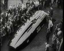 Sir Henry Segrave AKA Major Segrave's Car 'Sunbeam' Being Pushed By a Crowd of Civilians, 1927. Creator: British Pathe Ltd.