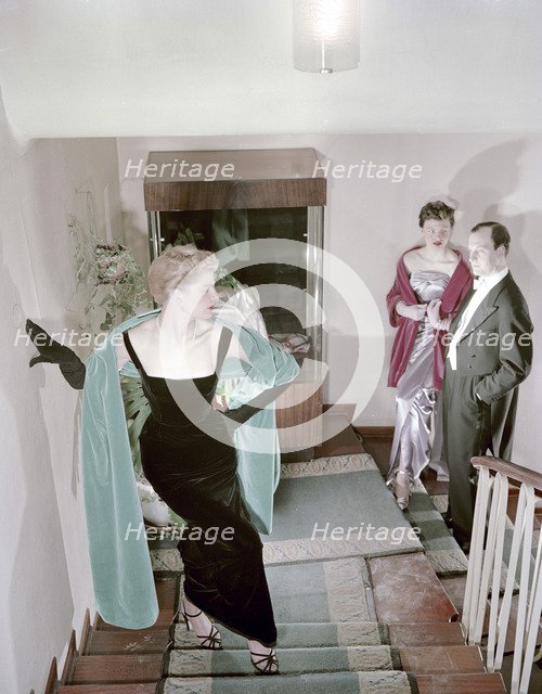 Female model shows an evening dress, Stockholm, 1950s. Artist: Göran Algård