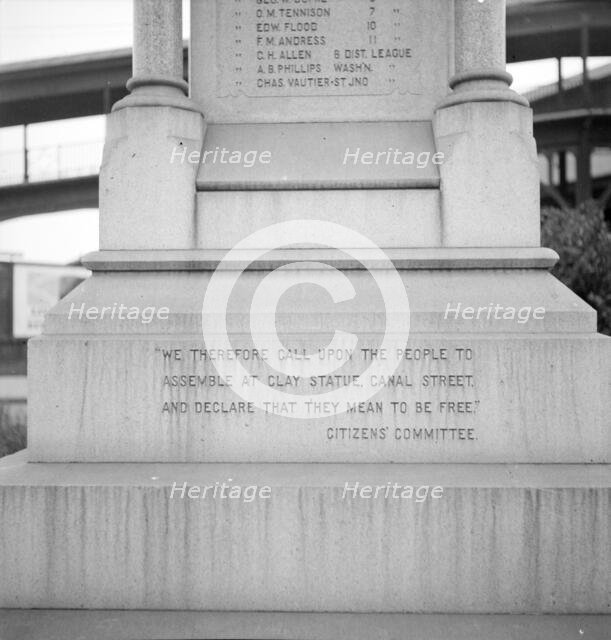 One side of the monument erected to race prejudice, New Orleans, Louisiana, 1936. Creator: Dorothea Lange.
