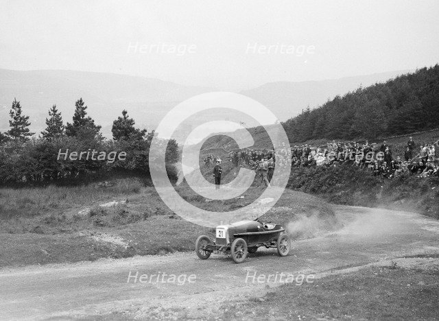 Aston Martin Bunny of Frank B Halford competing in the Caerphilly Hillclimb, Wales, 1923. Artist: Bill Brunell.