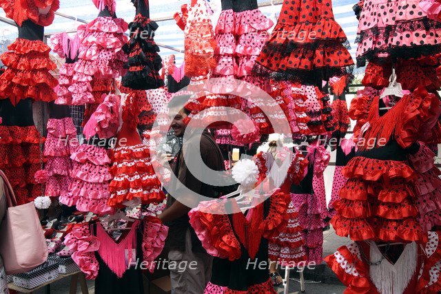 Colourful flamenco dresses for sale in a market, Mallorca, Spain.