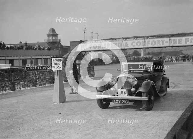 Bentley drophead coupe with Barker body competing in the JCC Rally, Brooklands, Surrey, 1939. Artist: Bill Brunell.