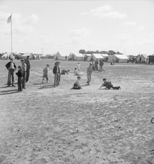 Marble time in FSA migratory labor camp, near Calipatria, Imperial Valley, CA, 1939. Creator: Dorothea Lange.