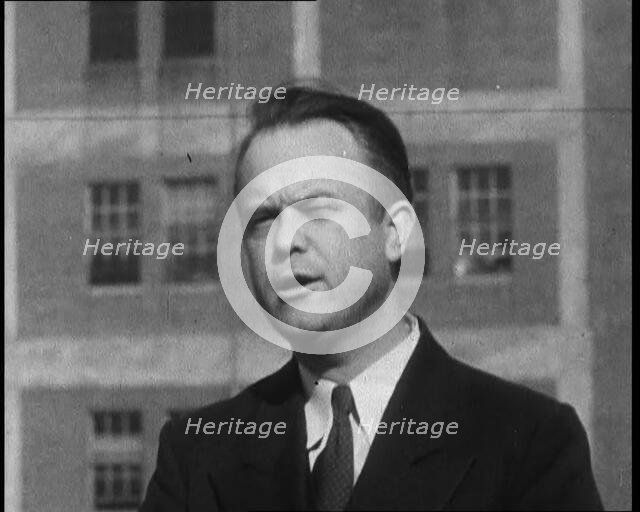 Male American Officer Giving an Official Statement Outside a Prison During the Investigation...,1930 Creator: British Pathe Ltd.