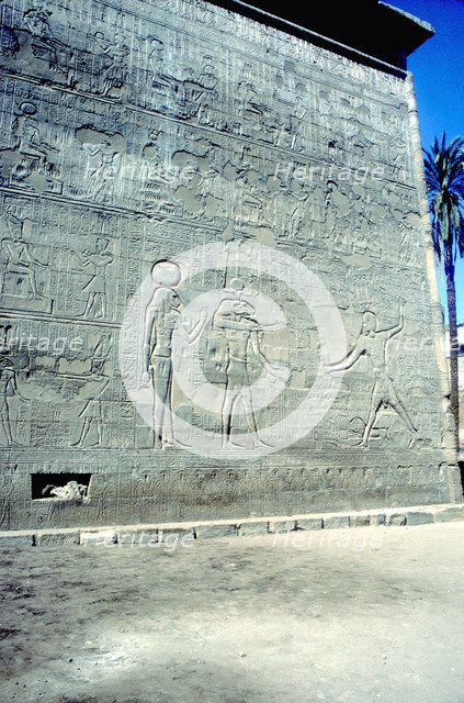 Reliefs of Pharaoh smiting enemies, The first Pylon, Temple of Khnum, Esna, Egypt. Artist: Unknown