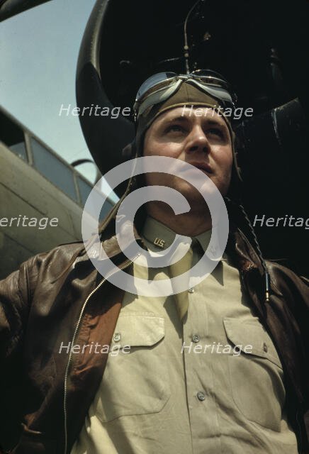 U.S. Army Air Forces pilot in front of a YB-17 bombing..., probably Langley field, Virginia, 1942. Creator: Alfred T Palmer.