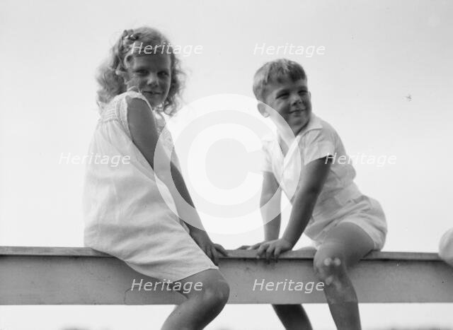 Kane children, seated on a fence, between 1911 and 1942. Creator: Arnold Genthe.