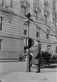 District of Columbia - Fire Alarm Box And Policeman, 1913. Creator: Harris & Ewing.
