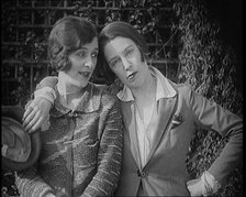 British Artists Norah Blaney and Gwen Farrah Posing for the Camera Smiling at Each Other, 1920. Creator: British Pathe Ltd.