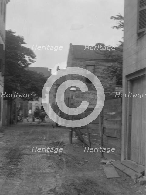 Street scene, New Orleans or Charleston, South Carolina, between 1920 and 1926. Creator: Arnold Genthe.