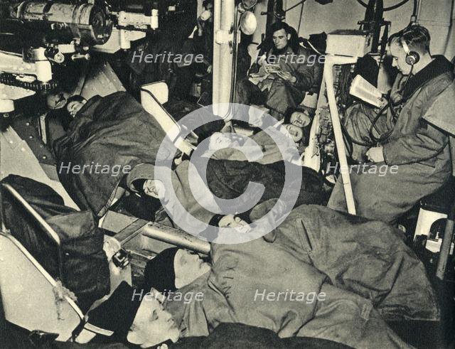 Royal Marines sleeping in the gunhouse of a warship, World War II, c1939-c1943 (1944). Creator: Unknown.