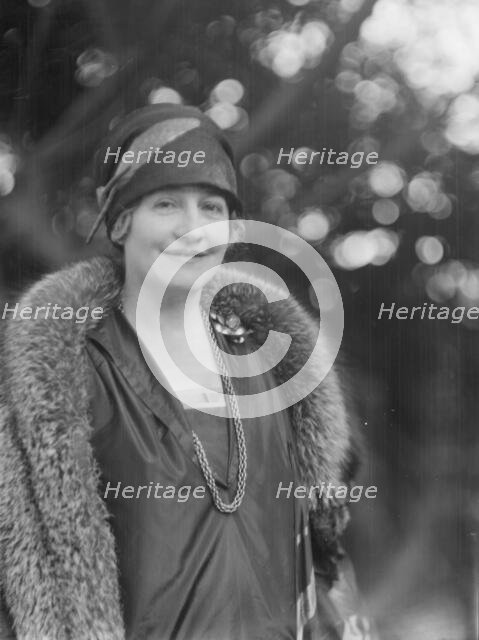 Alanson, Bertram, Mrs., standing outdoors, between 1927 and 1937. Creator: Arnold Genthe.