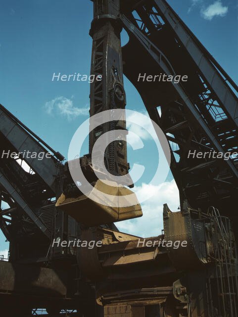 Pennsylvania R.R. ore docks, a "Hulett" ore unloader in operation, Cleveland, Ohio, 1943. Creator: Jack Delano.