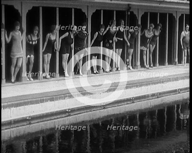 A Group of Young Female Civilians Wearing Short Swimsuits and Heeled Shoes Emerging from..., 1920. Creator: British Pathe Ltd.