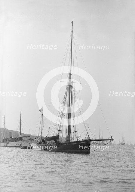 The 40 ton yawl 'Hyacinth' at anchor, 1913. Creator: Kirk & Sons of Cowes.