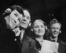 People Listening to Parents Calling Evacuee Children in America Over the Radio, 1940. Creator: British Pathe Ltd.