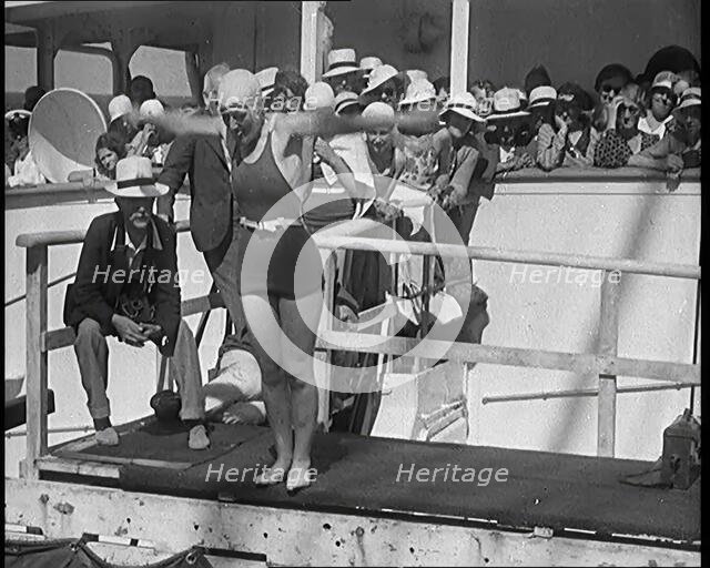 Female Civilian Diving Into the Shipboard Swimming Pool With a Crowd of Other Civilians..., 1931. Creator: British Pathe Ltd.