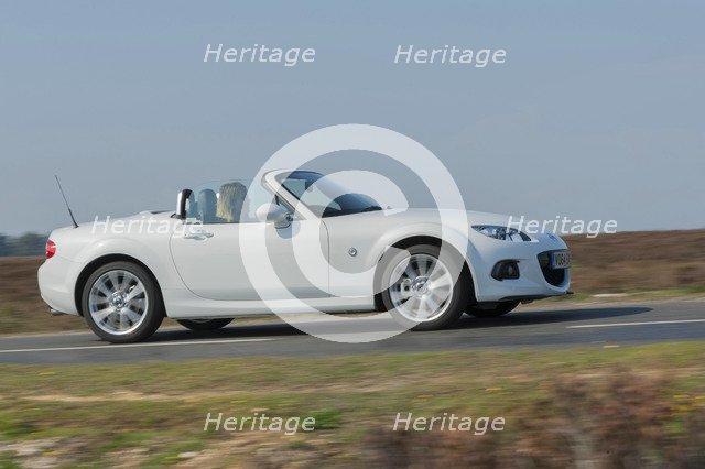 2014 Mazda MX5 Roadster Coupe Artist: Unknown.