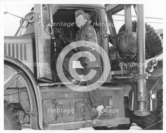 An American WAC sergeant climbing into an army truck, Fort Sheridan, Illinois, USA, 1940s. Artist: Unknown