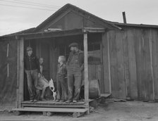 Stump farm family and their present home, Boundary County, Idaho, 1939. Creator: Dorothea Lange.