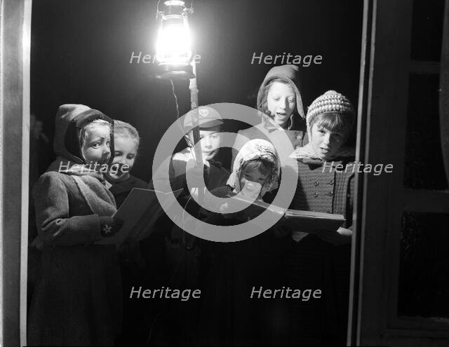 Carol singers, c1955. Creator: Arthur Charles Kirby Ware.
