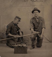 Two Plumbers with a Pipe, Pipe Cutter, and Toolbox, 1870s-80s. Creator: Unknown.