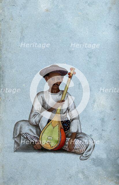 A musician holding a sitar, (between 1800 and 1899?). Creator: Unknown.