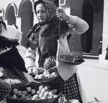 A girl selling apples, Zagreb, Croatia, Yugoslavia, 1939. Artist: Unknown