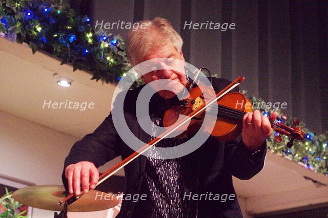 Mike Piggott, East Grinstead Jazz Club, Apron Café, Chequer Mead Theatre, West Sussex, April 2025. Creator: Brian O'Connor.