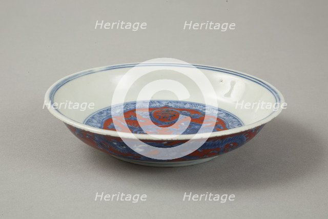 Red clobbered blue and white saucer with stork, phoenix and dragons, Jiajing (1522-1566). Artist: Unknown.