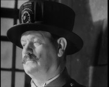 Beefeater guarding the Crown Jewels at the Tower of London, 1937.  Creator: British Pathe Ltd.