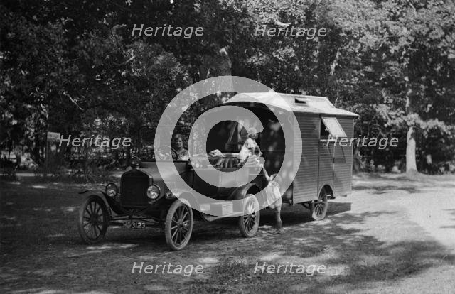 1921 Ford Model T with caravan. Creator: Unknown.