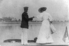 Man assisting woman into boat, Oyster Bay, Long Island, N.Y., 1905. Creator: Frances Benjamin Johnston.